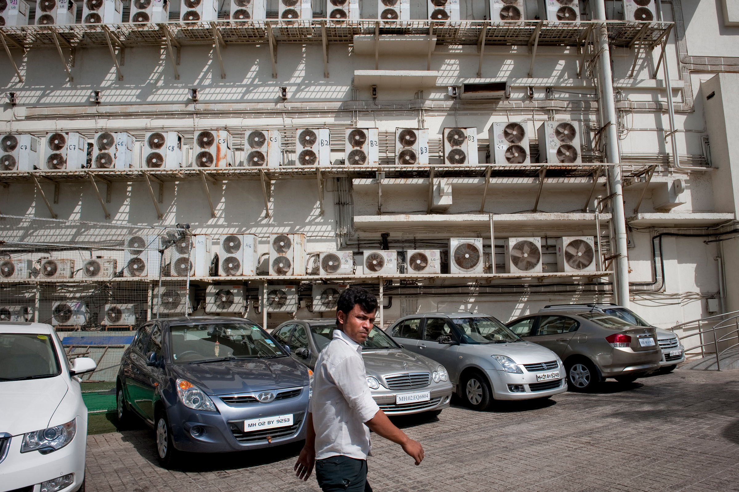 Air conditioning units installed outside of a shopping mall in Mumbai in May 2012. (Chiara Goia—The New York Times/Redux)