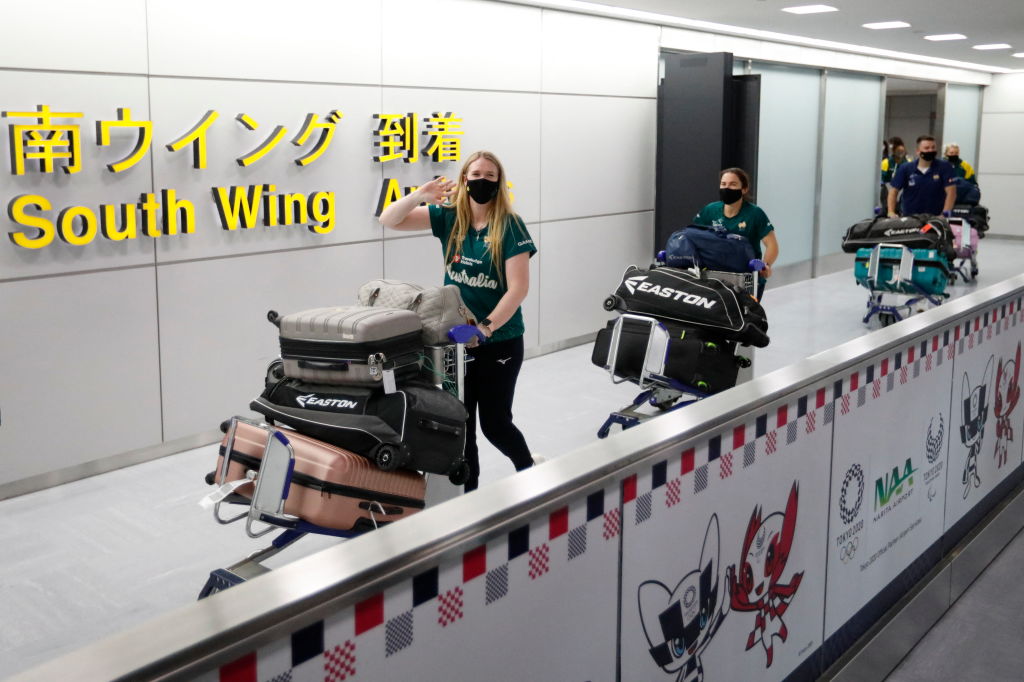 Members of Australia's Olympic softball team, the first national team to come to Japan for pre-Olympic training camp since the Tokyo 2020 Olympic Games were postponed to 2021 due to COVID-19, arrive at Narita International Airport in Narita, east of Tokyo, on June 1, 2021. (Issei Kato—POOL/AFP/Getty Images)