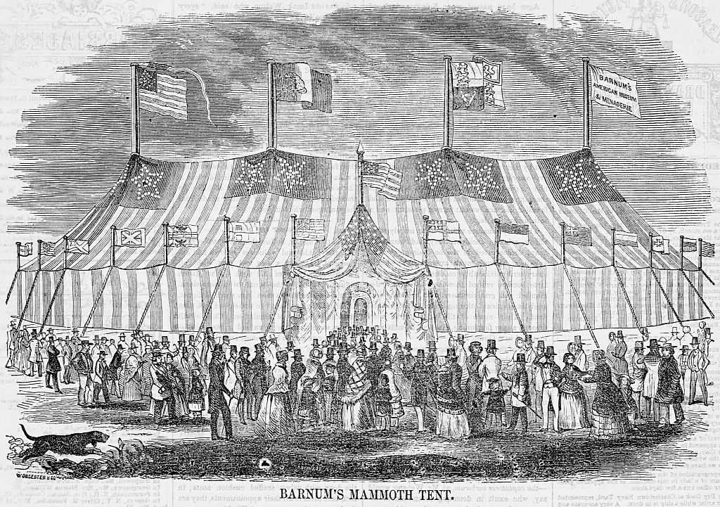 A crowd of people stream into P.T. Barnum's circus tent (Corbis via Getty Images)