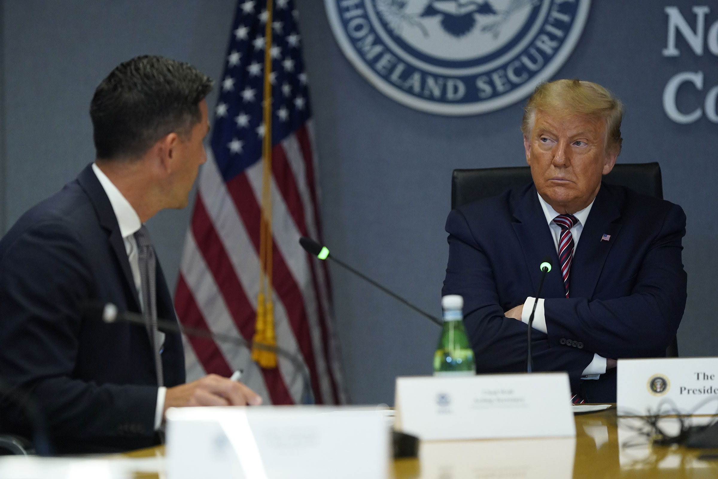 President Donald Trump listens while Chad Wolf, acting secretary of the Department of Homeland Security speaks during a meeting at FEMA headquarters in Washington on Aug. 27, 2020. (Erin Scott—Polaris/Bloomberg/Getty Images)