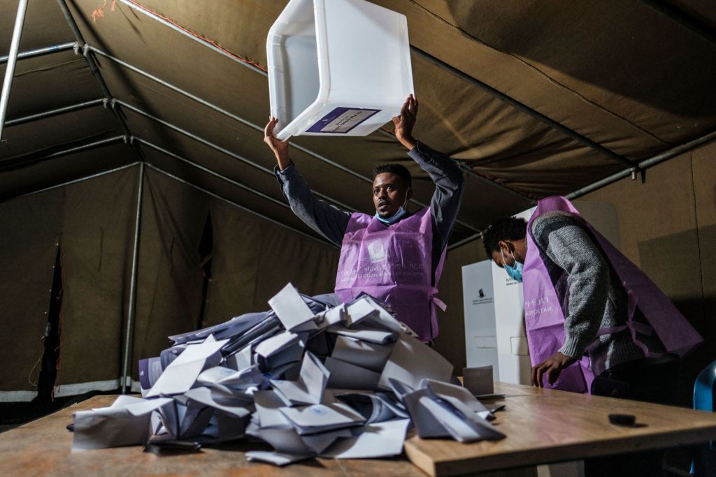 An electoral official with an empty ballot box after the closing of the polls in the city of Bahir Dar, Ethiopia on June 21, 2021. (Eduardo Soteras—AFP/Getty Images)