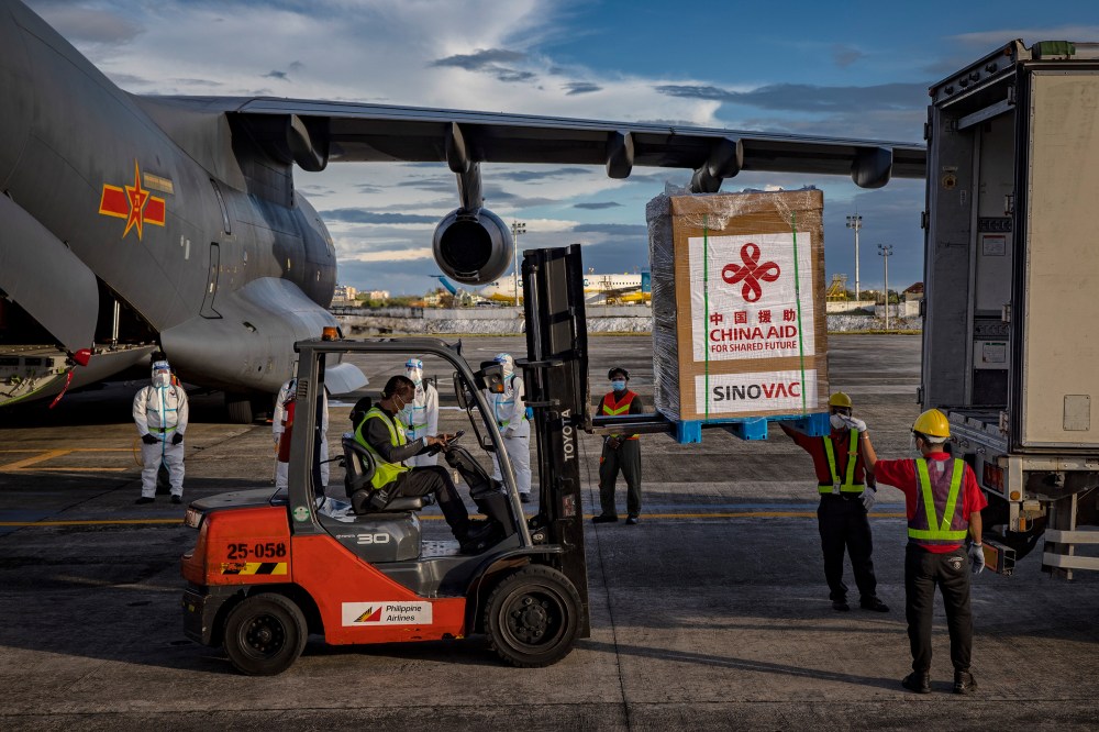 A crate containing Sinovac Biotech COVID-19 vaccines is loaded into a truck upon arrival at Ninoy Aquino International Airport in Manila on Feb. 28. Duterte witnessed the arrival of 600,000 doses donated by the Chinese government.
