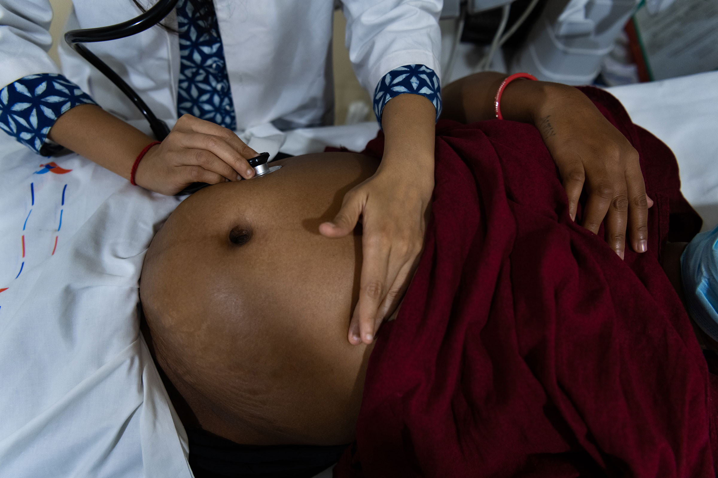 Kajal Vasava, 24, undergoes a checkup at Akanksha, seven months into her pregnancy. A first-time surrogate, Vasava has brought her 3-year-old daughter to stay with her at the clinic for the entire duration of her pregnancy. She turned to surrogacy after financial difficulties during India's COVID-19 lockdown.