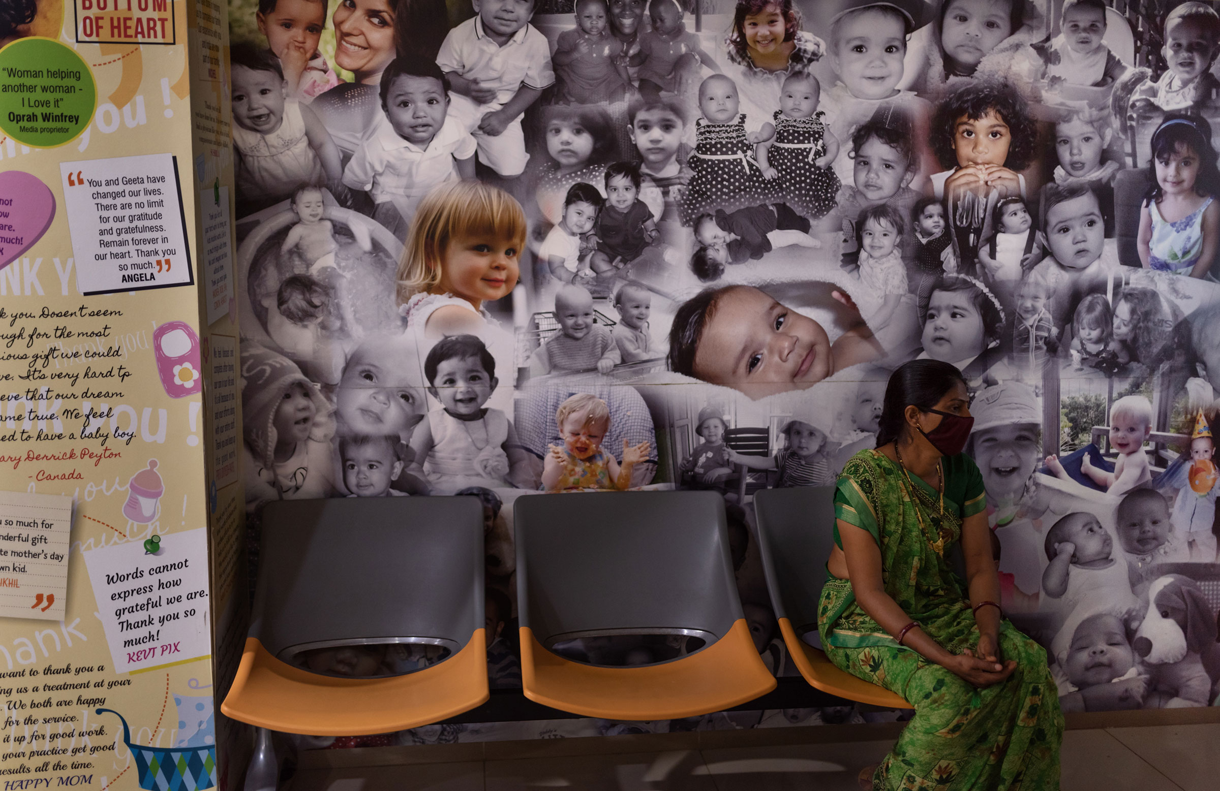 Posters of babies born through surrogacy decorate the walls of the reception area of the Akanksha Hospital. (Smita Sharma for TIME)