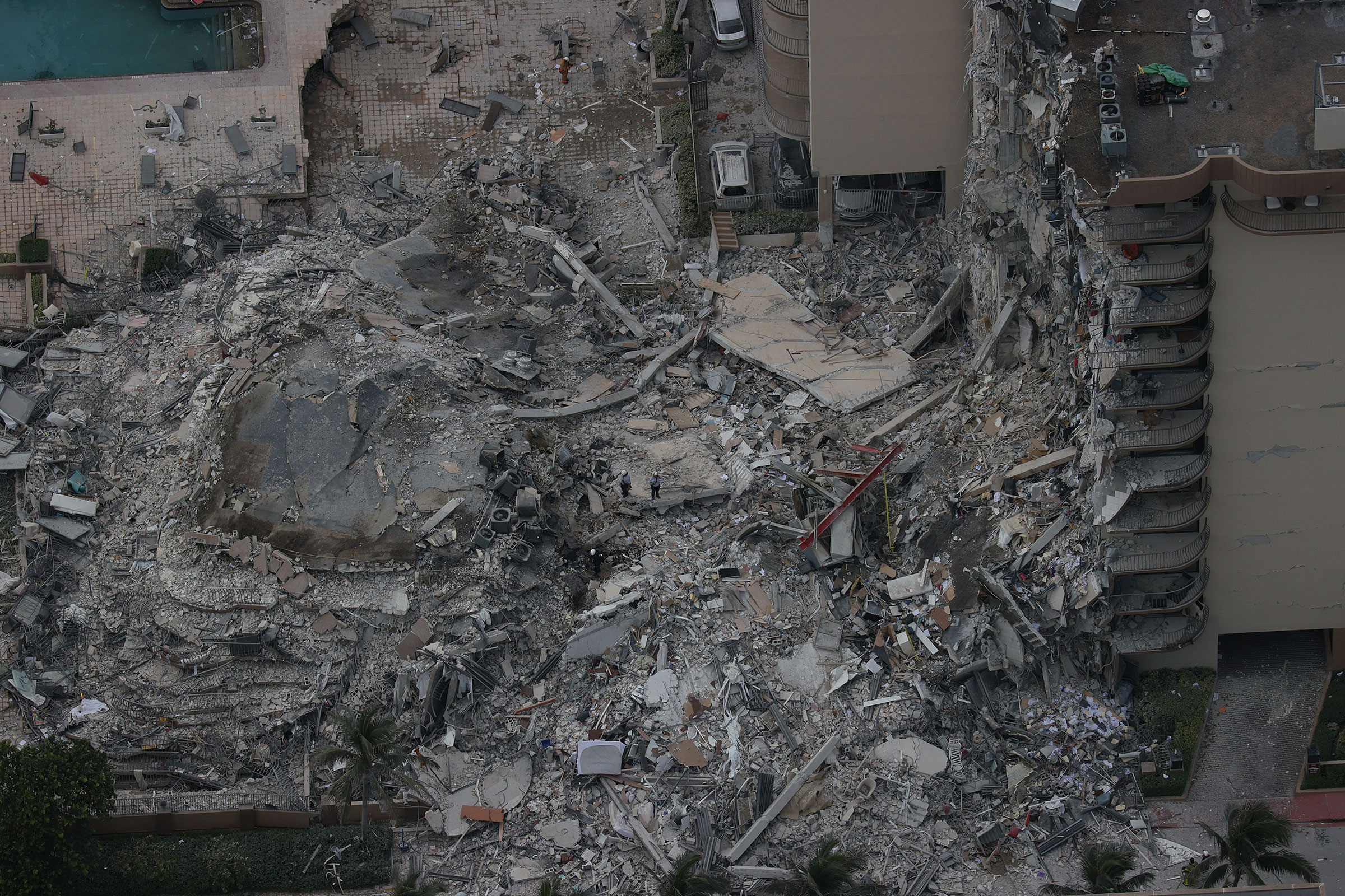 Search and rescue personnel work in the rubble of the 12-story condo tower that crumbled to the ground in Surfside on June 24, 2021. (Joe Raedle—Getty Images)