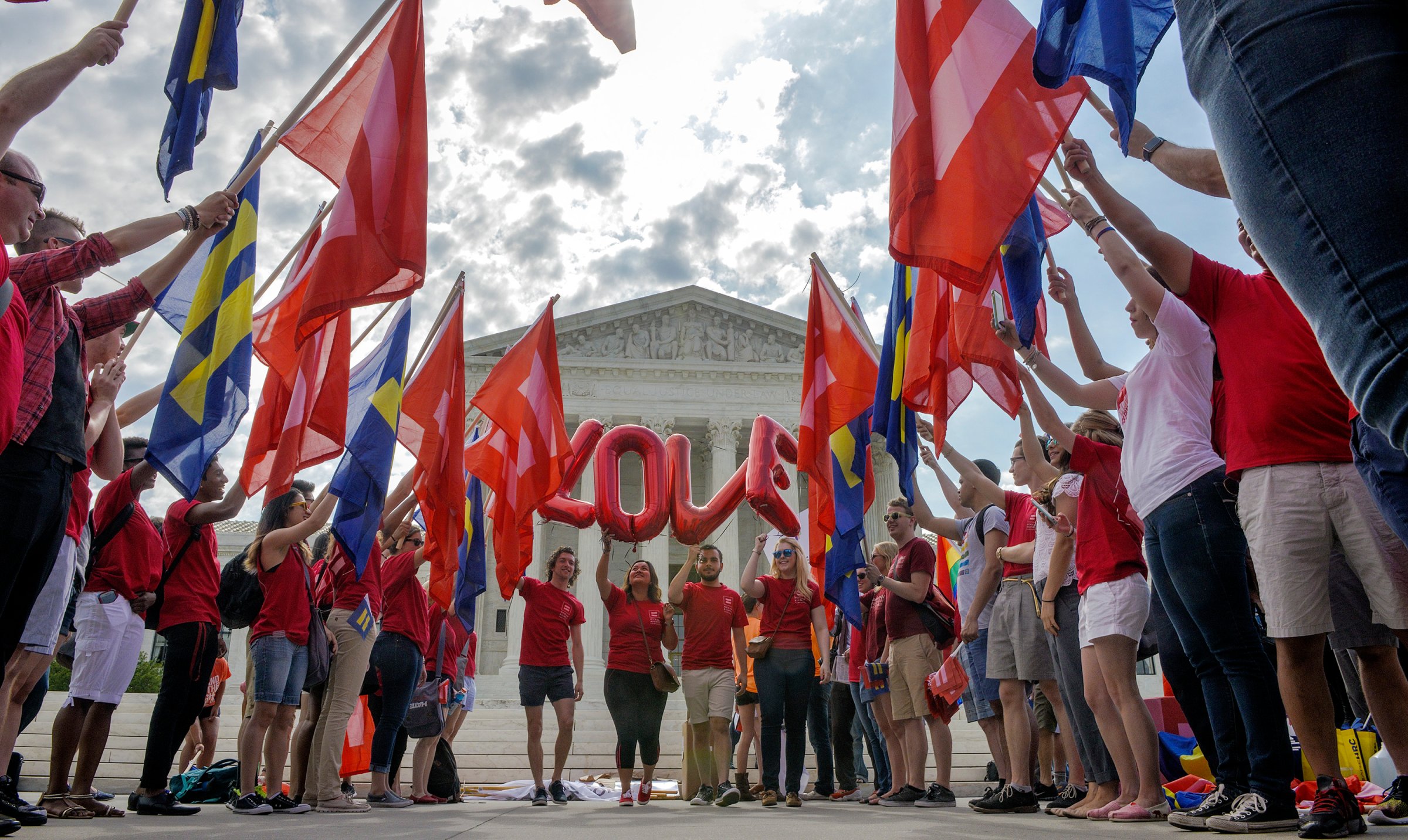 Supporters of same sex marriage rally in front of the Supreme Court awaiting a ruling to legalize gay marriage nationwide in Washington on June, 25, 2015.