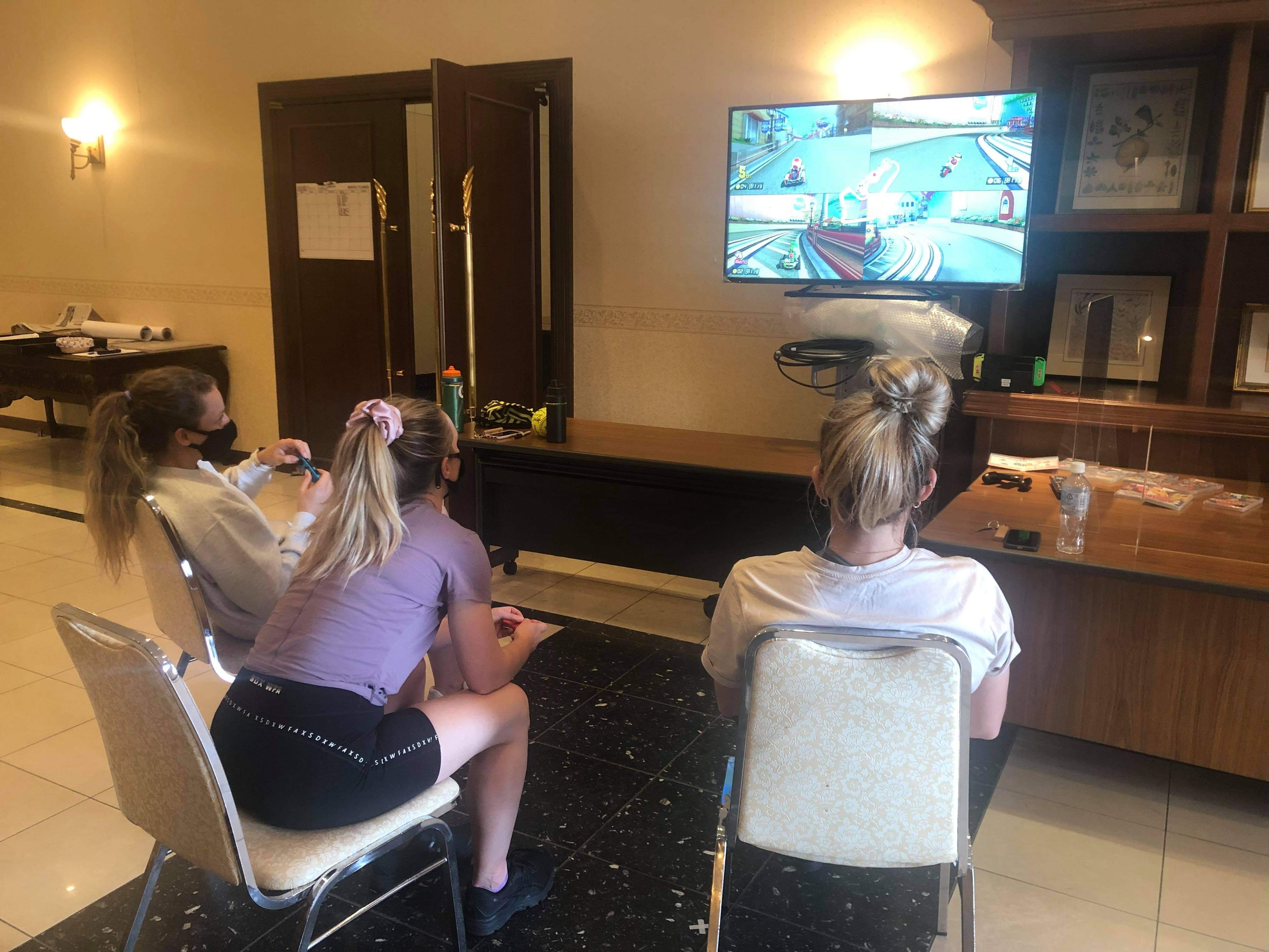Australian softball players passing time by playing Nintendo Switch in their hotel in Ota, Japan. (Photo courtesy of Softball Australia)
