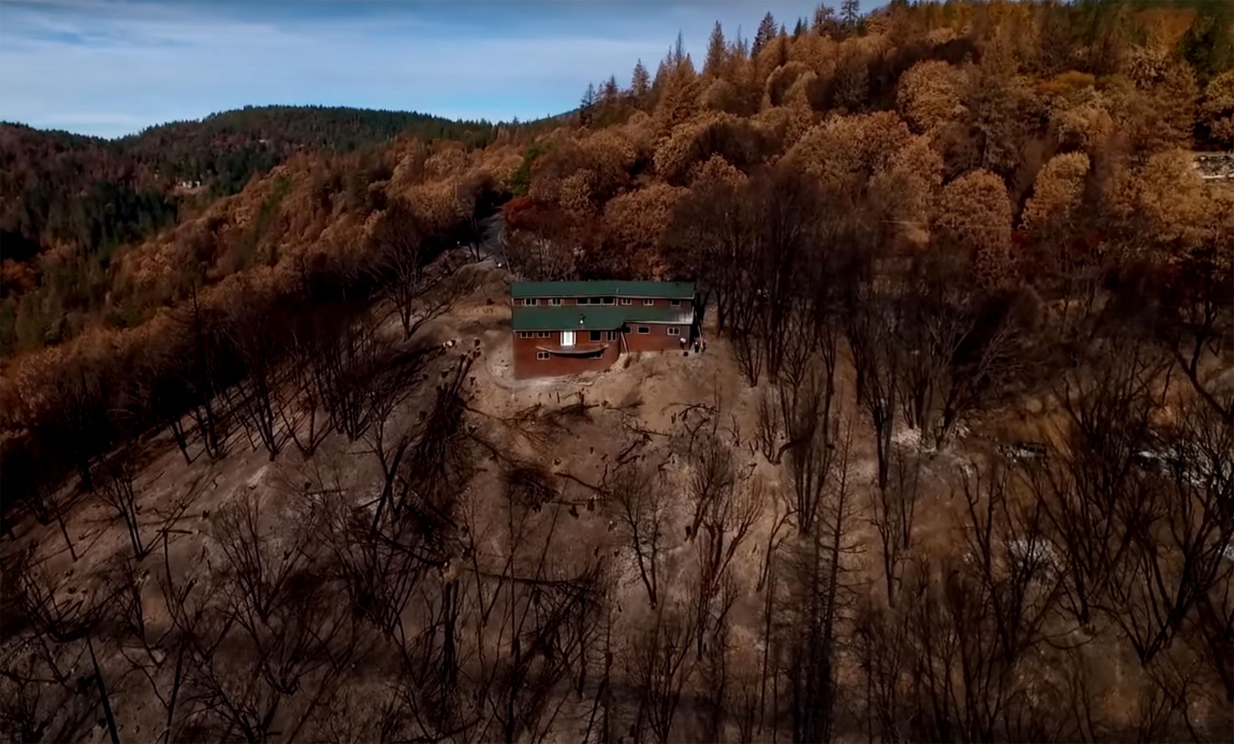 An aerial photo shows Sean Jennings' home surrounded by scorched land after a 2015 wildfire in northern California. (Courtesy Sean Jennings)