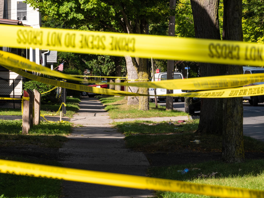 Police tape lines a crime scene after a shooting at a backyard party on September 19, 2020, in Rochester, New York. (Joshua Rashaad McFadden—Getty Images)