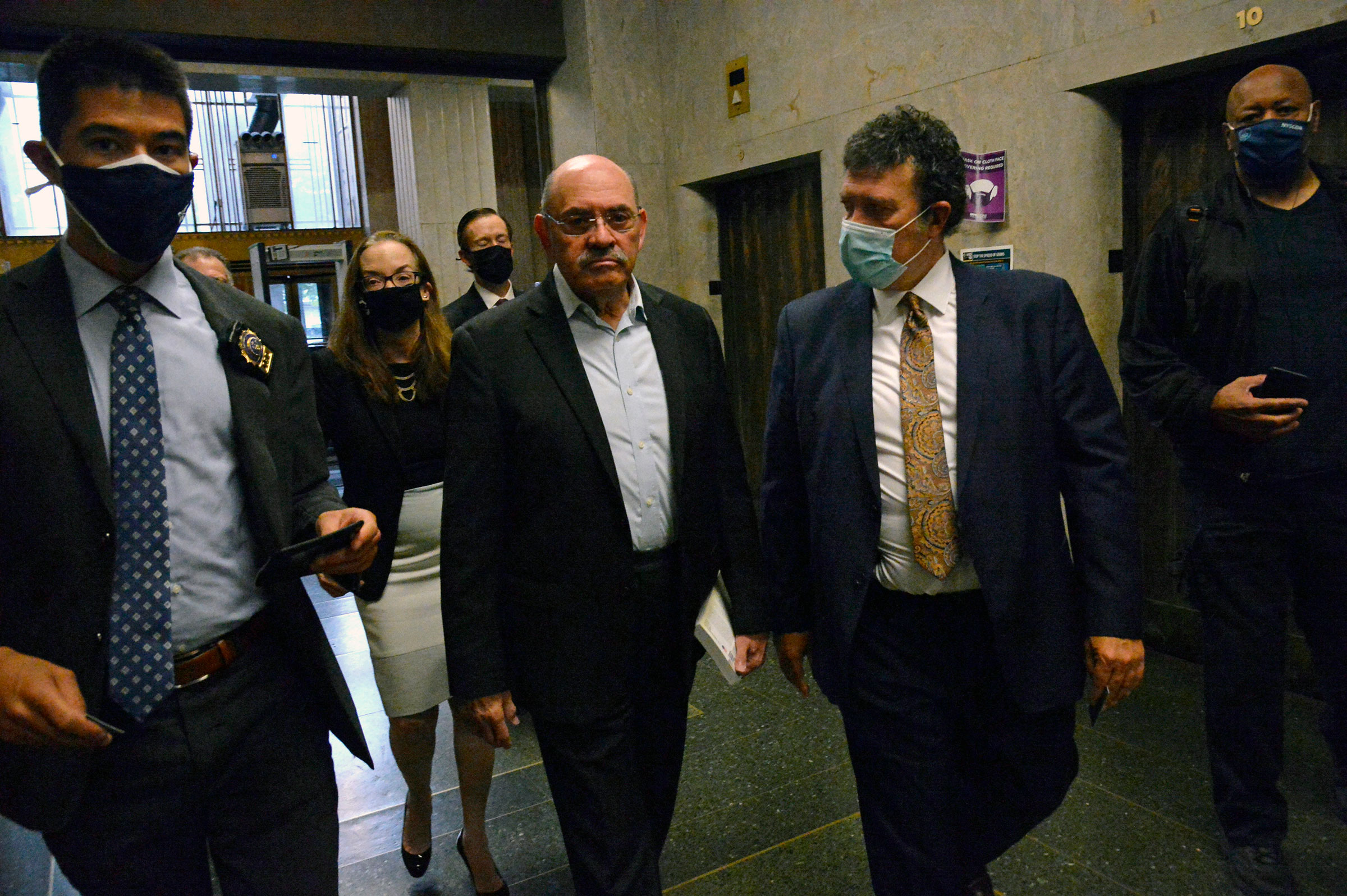 Allen Weisselberg, second from left, Donald Trump's long-serving chief financial officer, surrenders Thursday morning, July 1, 2021, at the lower Manhattan building that houses the criminal courts and the district attorney's office. (Jefferson Siegel/The