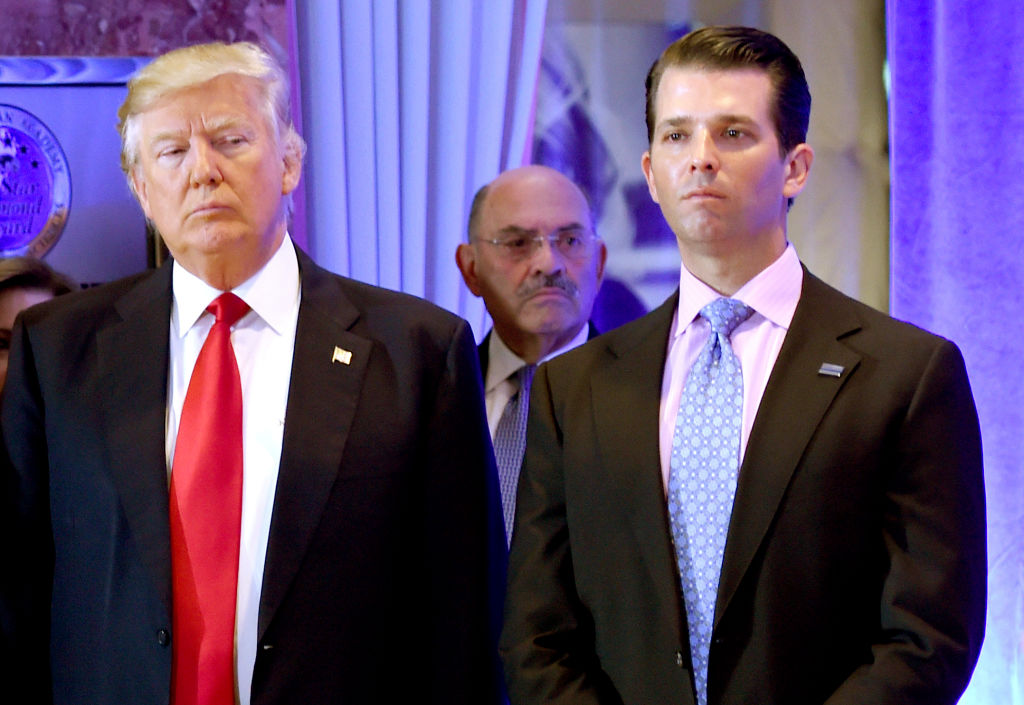 US President-elect Donald Trump along with his son Donald, Jr., arrive for a press conference at Trump Tower in New York, as Allen Weisselberg (C), chief financial officer of The Trump, looks on January 11, 2017. (TIMOTHY A. CLARY—AFP / Getty Images)