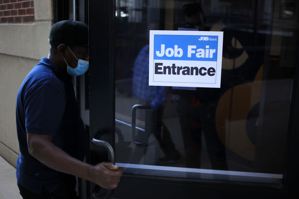 A job seeker wearing a protective mask arrives at a Job News USA career fair in Louisville, Kentucky, U.S., on Wednesday, June 23, 2021. (Luke Sharrett/Bloomberg via Getty Images)