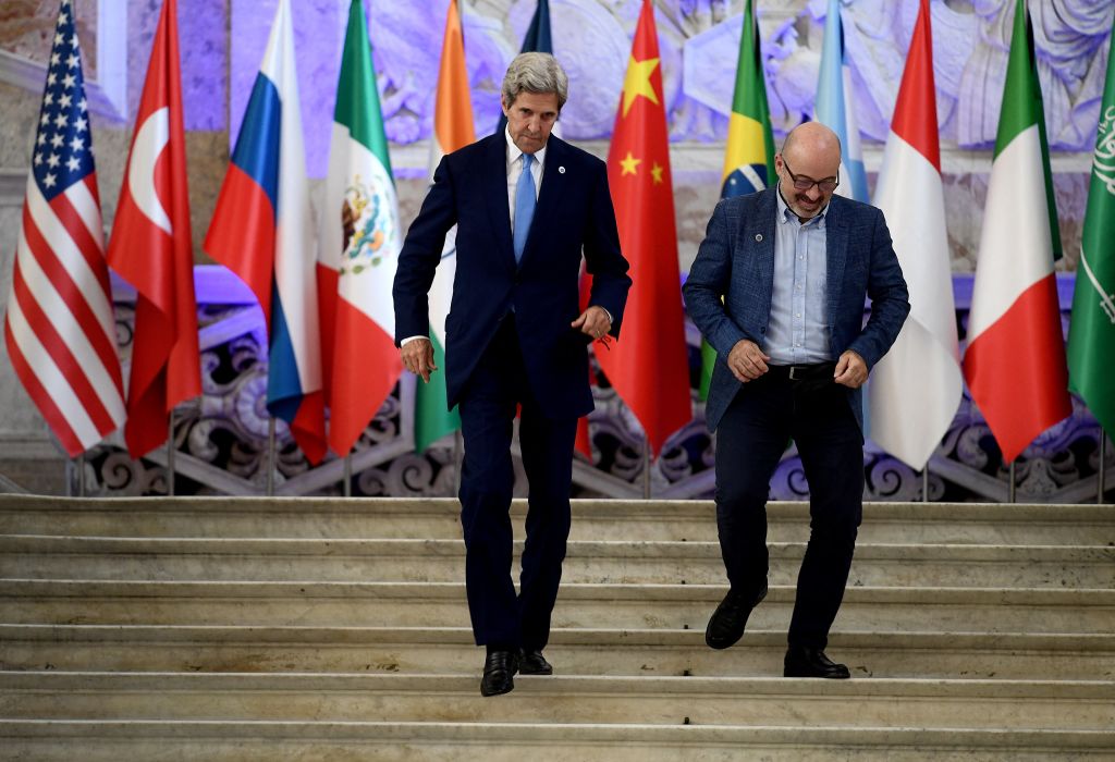 Italy's Ecological Transition Minister Roberto Cingolani, right, meets with US Special Presidential Envoy for Climate John Kerry, left, for the climate and energy G20 meeting in Naples, Italy, on July 23, 2021. (Filippo Monteforte—AFP/Getty Images)
