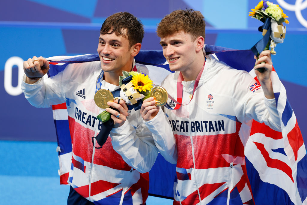 Thomas Daley and Matthew Lee of Team Great Britain pose for photographers with their gold medals after winning the Men's Synchronised 10m Platform Final on day three of the Tokyo 2020 Olympic Games at Tokyo Aquatics Centre on July 26, 2021. (Fred Lee—Getty Images)