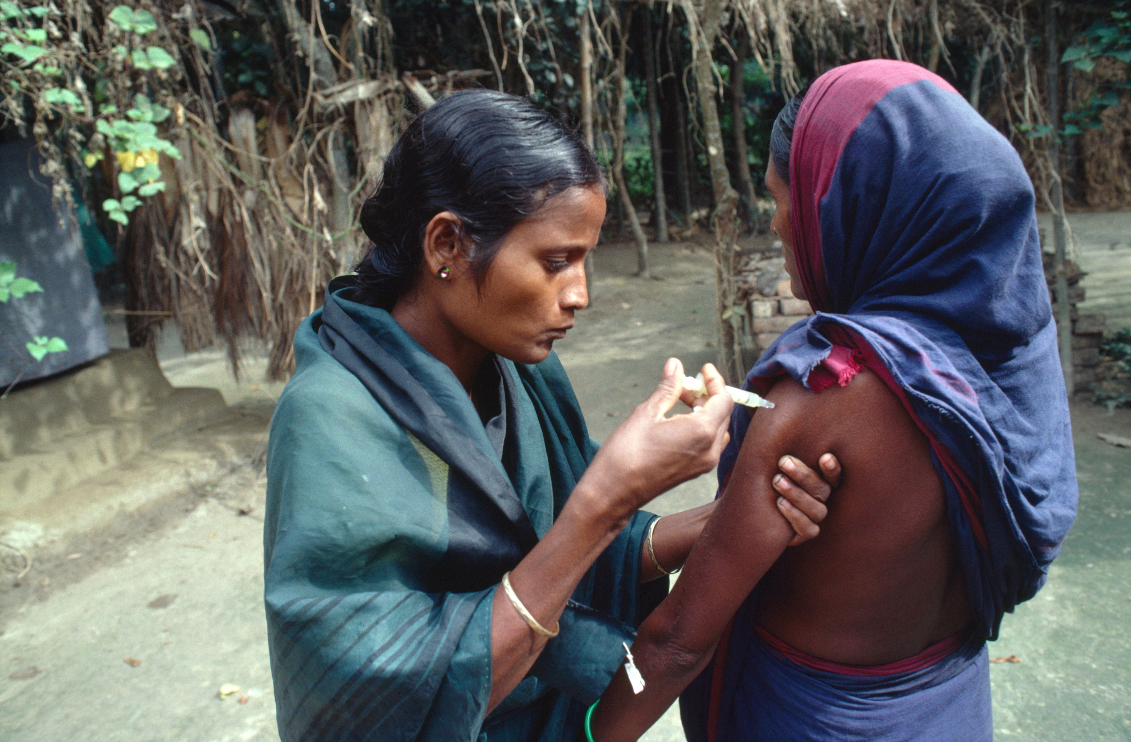 Hashina Akhtar giving A three-monthly injection of the contraceptive Depro-Provera in Mobarakdi Village, Matlab District. (Universal Images Group via Getty—Still Pictures)