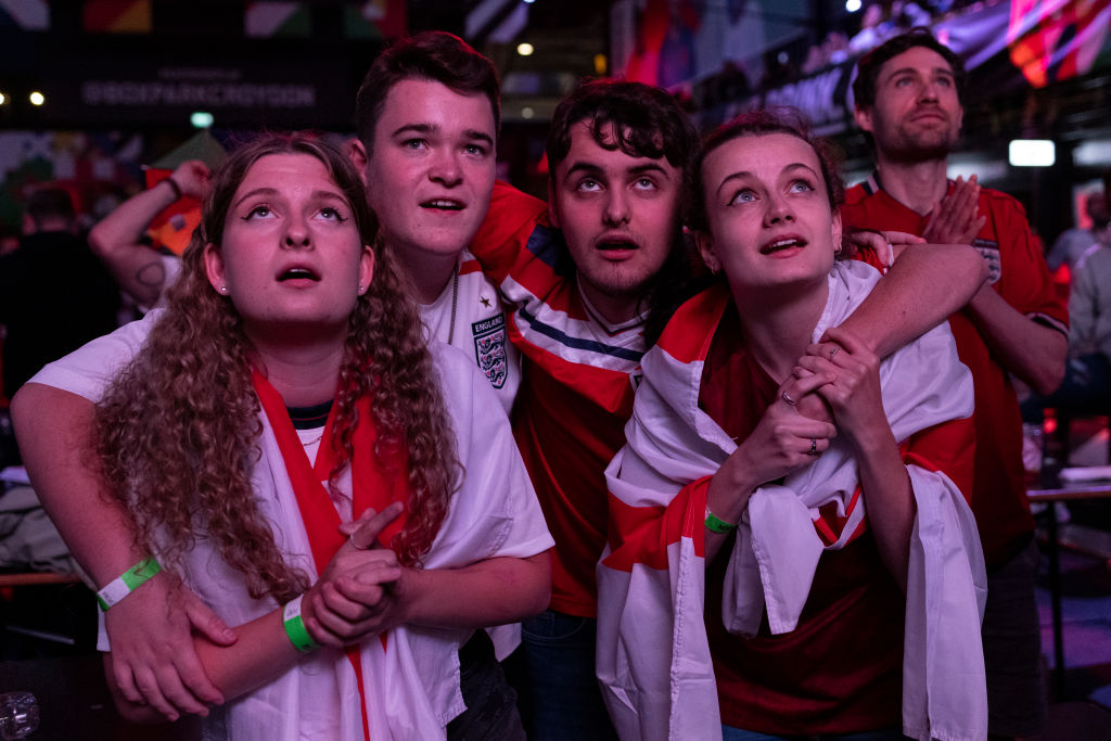 Tense England fans watch the final few minutes of the live broadcast of the semi-final match between England and Denmark at BOXPARK Croydon on July 07, 2021 in London, England (Dan Kitwood—Getty Images)