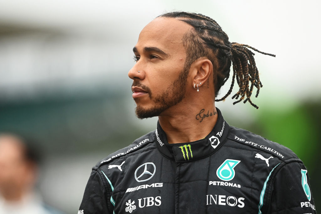 Lewis Hamilton of Great Britain and Mercedes GP looks on as the prototype for the 2022 F1 season is unveiled during previews ahead of the F1 Grand Prix of Great Britain at Silverstone on July 15, 2021 in Northampton, England (Michael Regan—Getty Images)