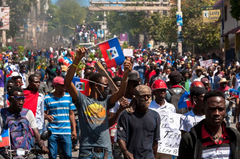 Haitians demonstrate during a protest to denounce the draft constitutional referendum carried by the President Jovenel Moise on March 28, 2021 in Port-au-Prince, Haiti.