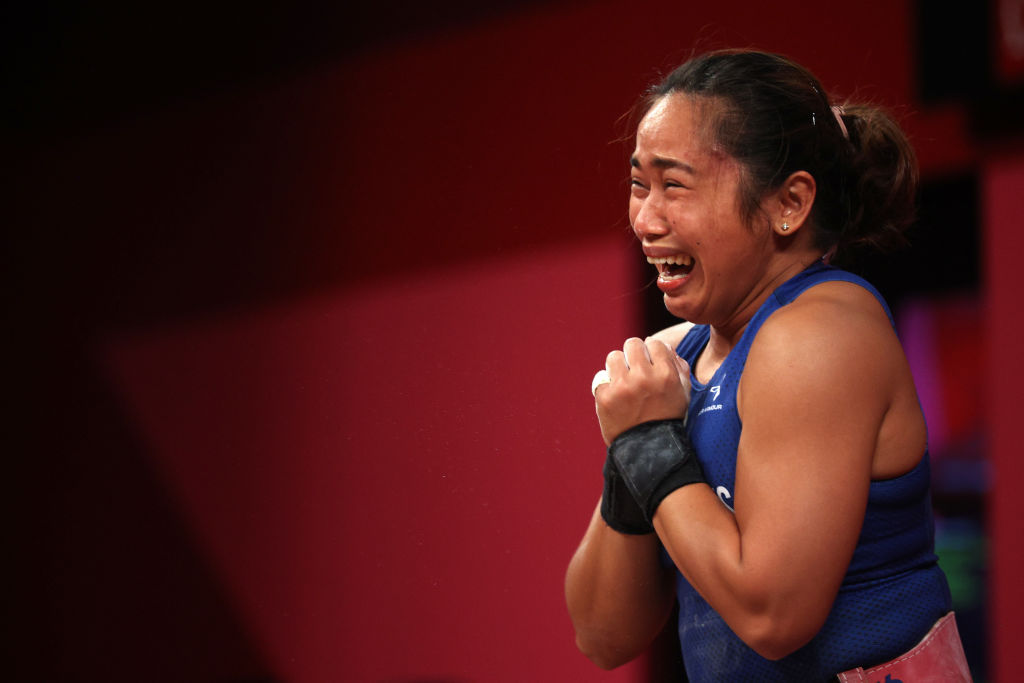 Hidilyn Diaz of Team Philippines competes during the women's weight lifting 55kg competition on day three of the Tokyo 2020 Olympic Games at Tokyo International Forum on July 26, 2021 in Tokyo, Japan. (Chris Graythen—Getty Images)
