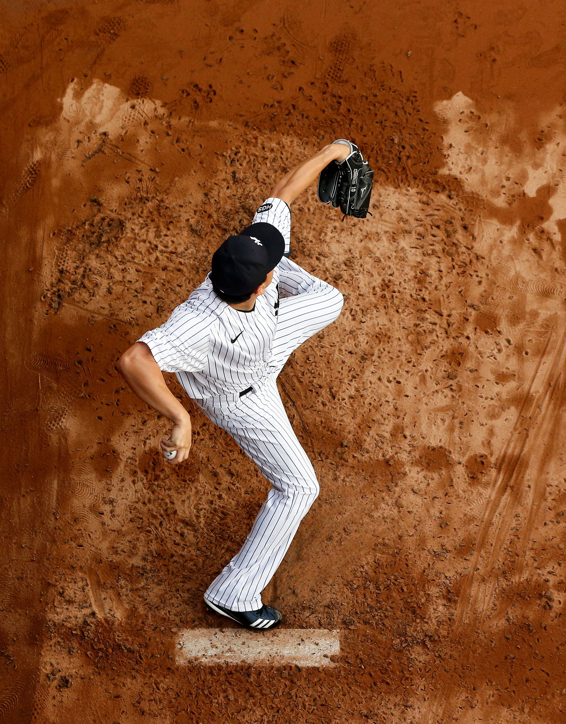Masahiro Tanaka of the New York Yankees warms up in the bullpen before a game against the Atlanta Braves on August 12, 2020 in New York City.