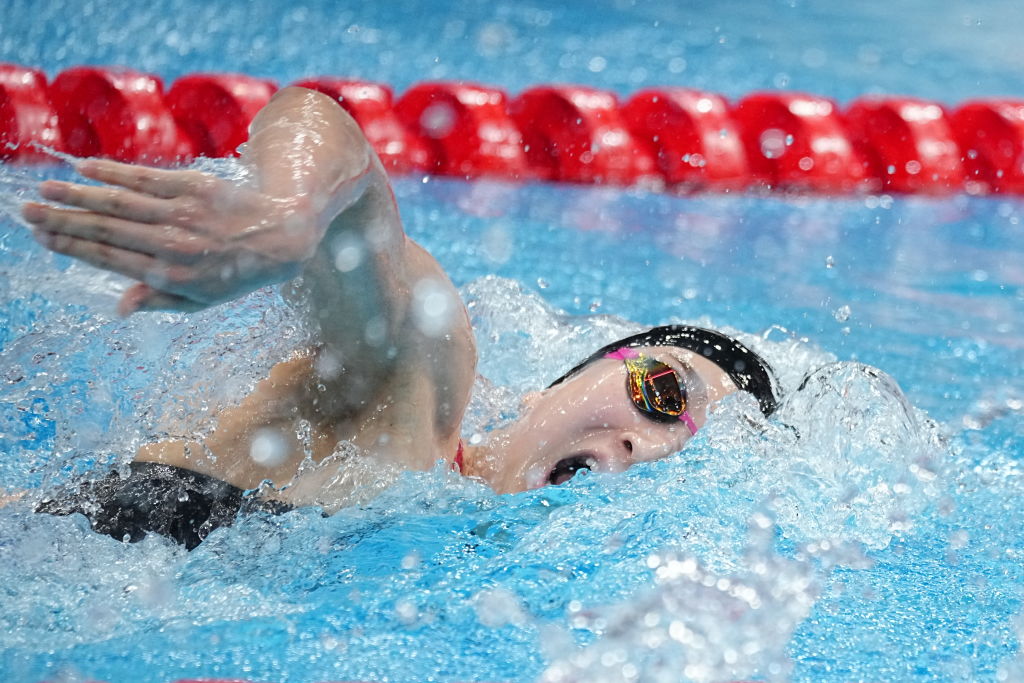 Rikako Ikee from Japan swims in Olympics heats in the women's 4 x 100 m freestyle at the Tokyo Aquatics Center. (Michael Kappeler–picture alliance/Getty Images)