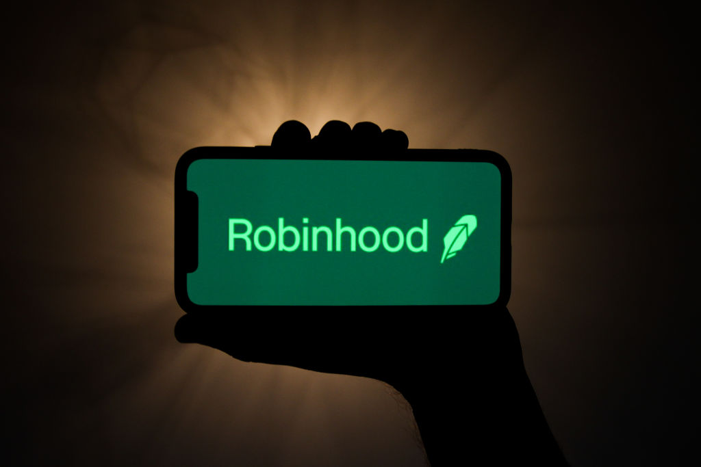 Robinhood Markets is seeking a valuation of $35 billion in its initial public offering, just short of the highest analyst projections, as the free trading app advances toward a debut likely to draw in buyers from its own novice investor base. (Jakub Porzycki–NurPhoto/Getty Images)