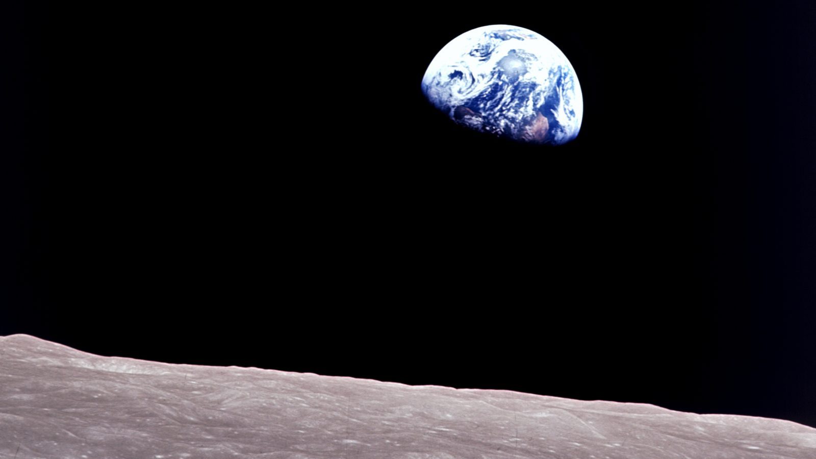 Taken aboard Apollo 8 by Bill Anders, this iconic picture shows Earth peeking out from beyond the lunar surface as the first crewed spacecraft circumnavigated the moon, with astronauts Anders, Frank Borman, and Jim Lovell aboard. (NASA)