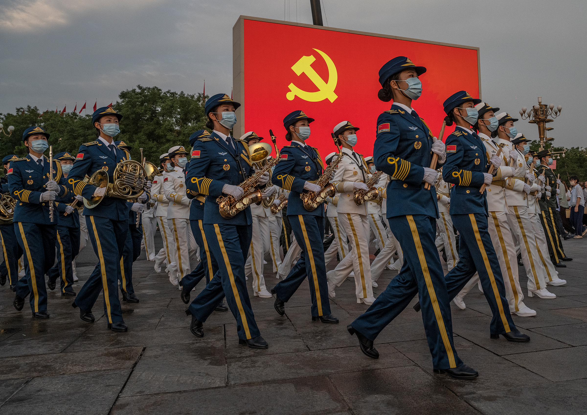 Female members of a People's Liberation Army ceremonial band march at a ceremony marking the 100th anniversary of the Chinese Communist Party in Beijing's Tiananmen Square on July 1. (Kevin Frayer—Getty Images)