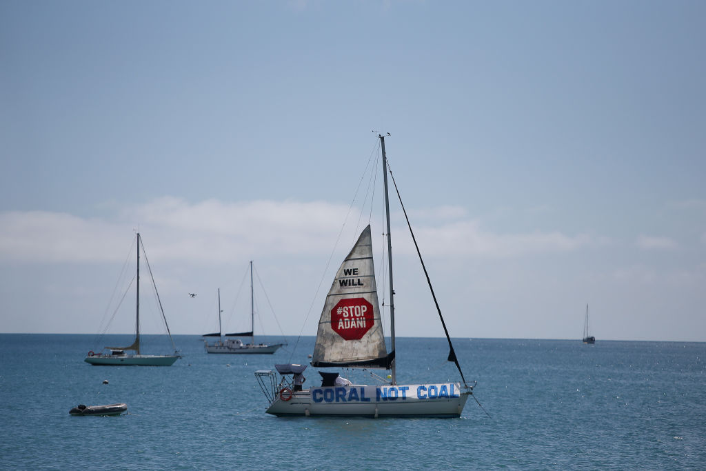 A boat launches a sail in protest to the Adani Carmichael Coal Mine proposal in Airlie Beach, Australia on April 26, 2019. (Lisa Maree Williams—Getty Images)