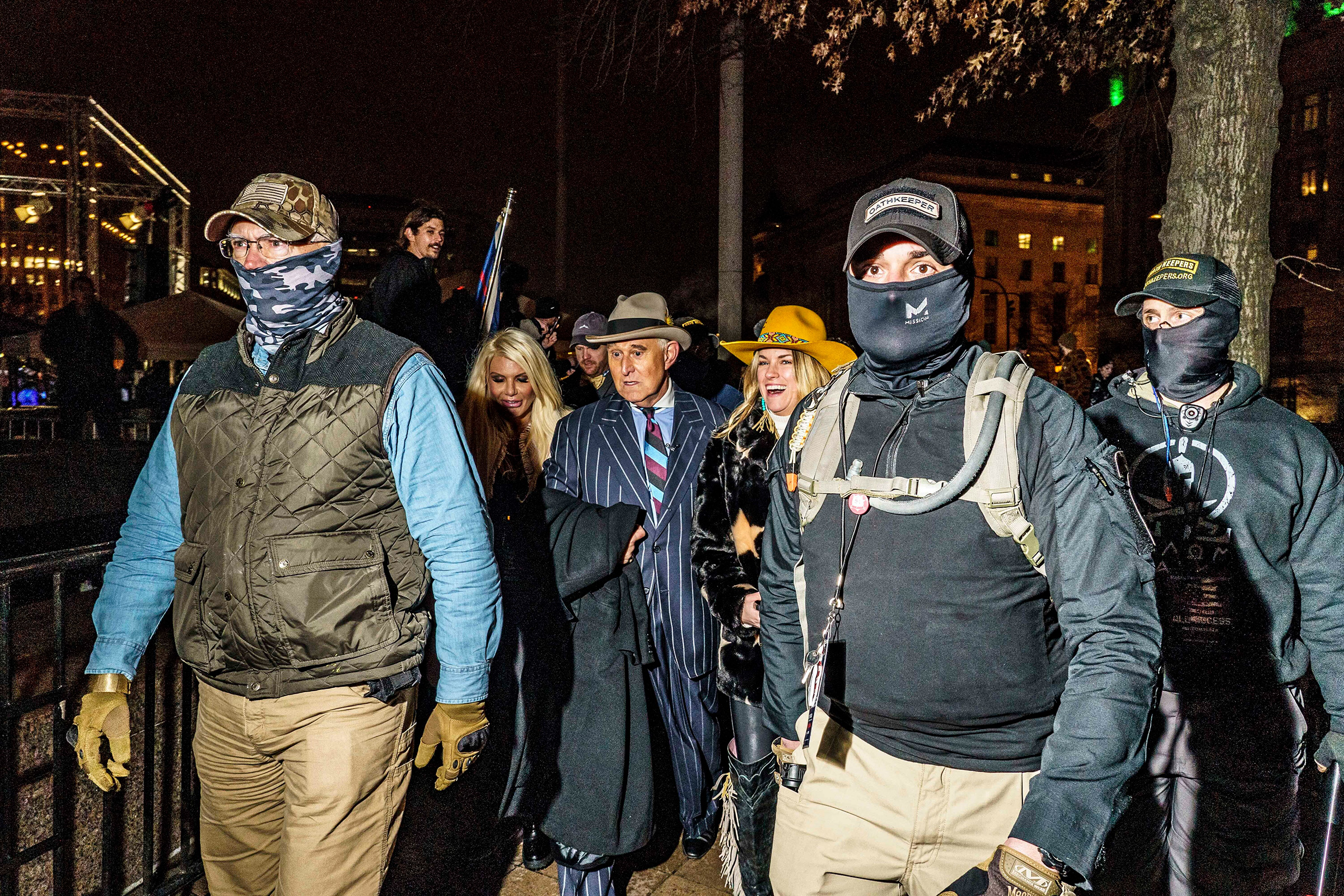 James, front right, and fellow Oath Keepers escort former Trump adviser Roger Stone to a rally in Washington the night before the insurrection