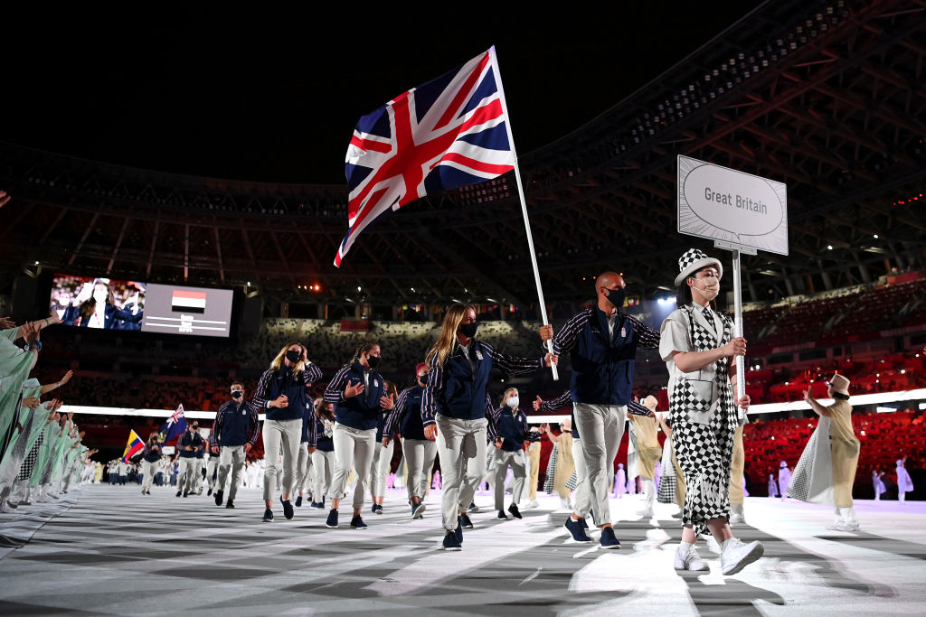 Flag bearers Hannah Mills and Mohamed Sbihi of Team Great Britain leads their team out during the Opening Ceremony of the Tokyo 2020 Olympic Games at Olympic Stadium on July 23, 2021 in Tokyo, Japan. (Matthias Hangst—Getty Images)