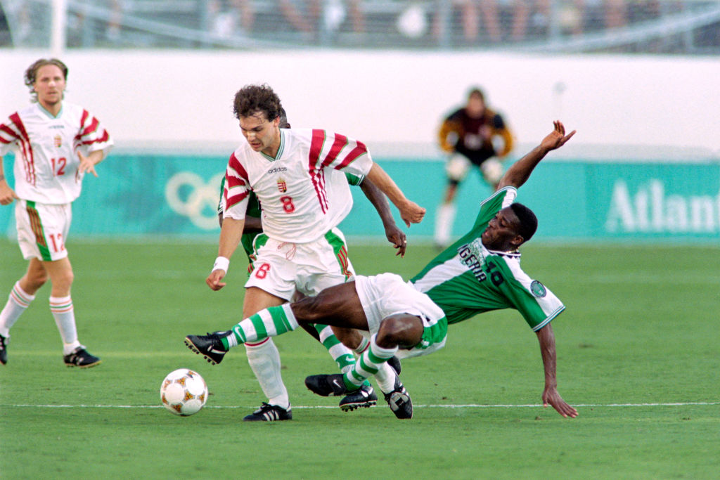 On July 21, 1996, Hungary's Tamas Sandorduring (C, 8) fights for the ball with Nigeria's Azuka Okocha (10) during the first half of their 1996 Summer Olympic match in Orlando. (Pascal George—AFP via Getty Images)