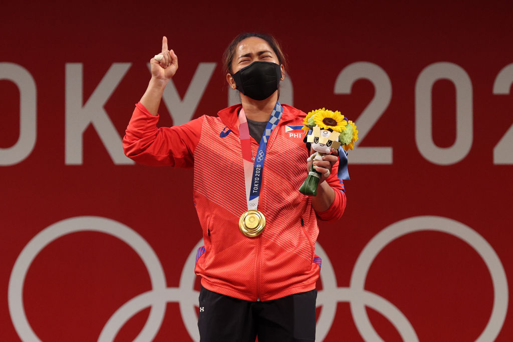 Gold medalist Hidilyn Diaz of Team Philippines poses with the gold medal during the medal ceremony for the Weightlifting - Women's 55kg Group A on day three of the Tokyo 2020 Olympic Games at Tokyo International Forum on July 26, 2021 in Tokyo, Japan. (Chris Graythen—Getty Images)