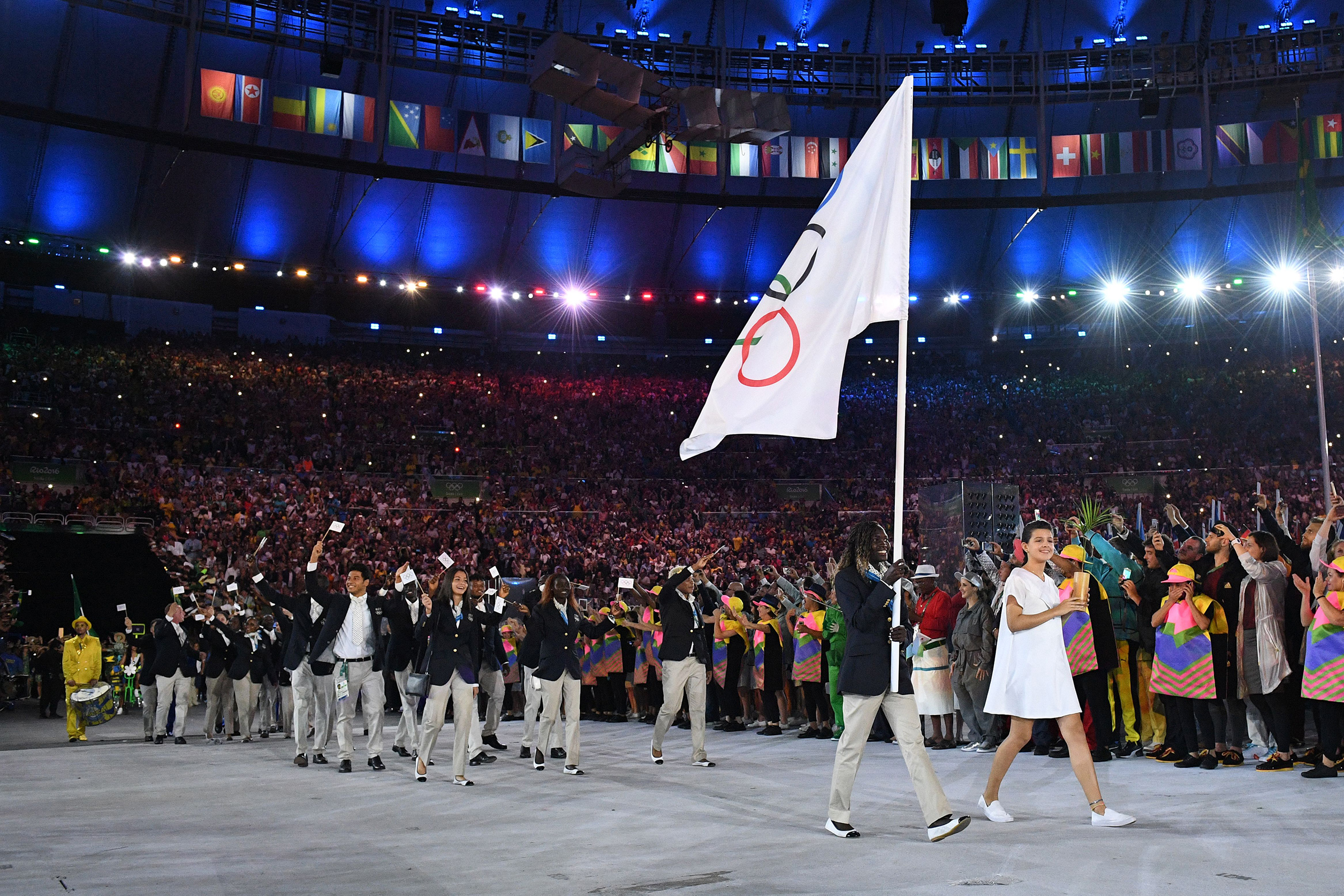 Rose Nathike Lokonyen carries the Olympic flag
