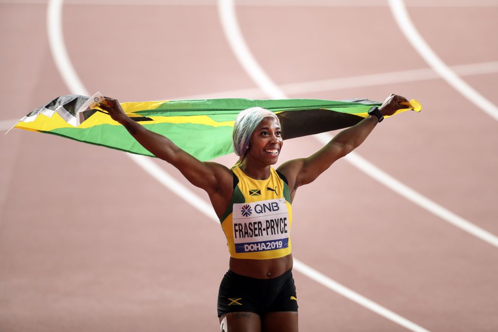 Shelly-Ann Fraser-Pryce of Jamaica celebrates winning the women's 100m final during the IAAF World Athletics Championships 2019 at the Khalifa Stadium in Doha, Qatar, 29 September 2019. (Serhat Cagdas—Anadolu Agency via Getty Images)