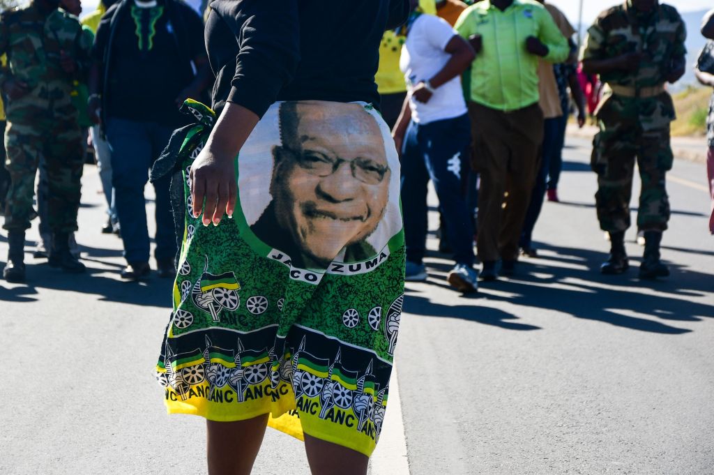 A group of Jacob Zuma supporters walking to the Zuma homestead on July 01, 2021 in Nkandla, South Africa. This comes after the former president was found guilty of contempt of court by the Constitutional Court of South Africa. (Darren Stewart/Gallo Images)