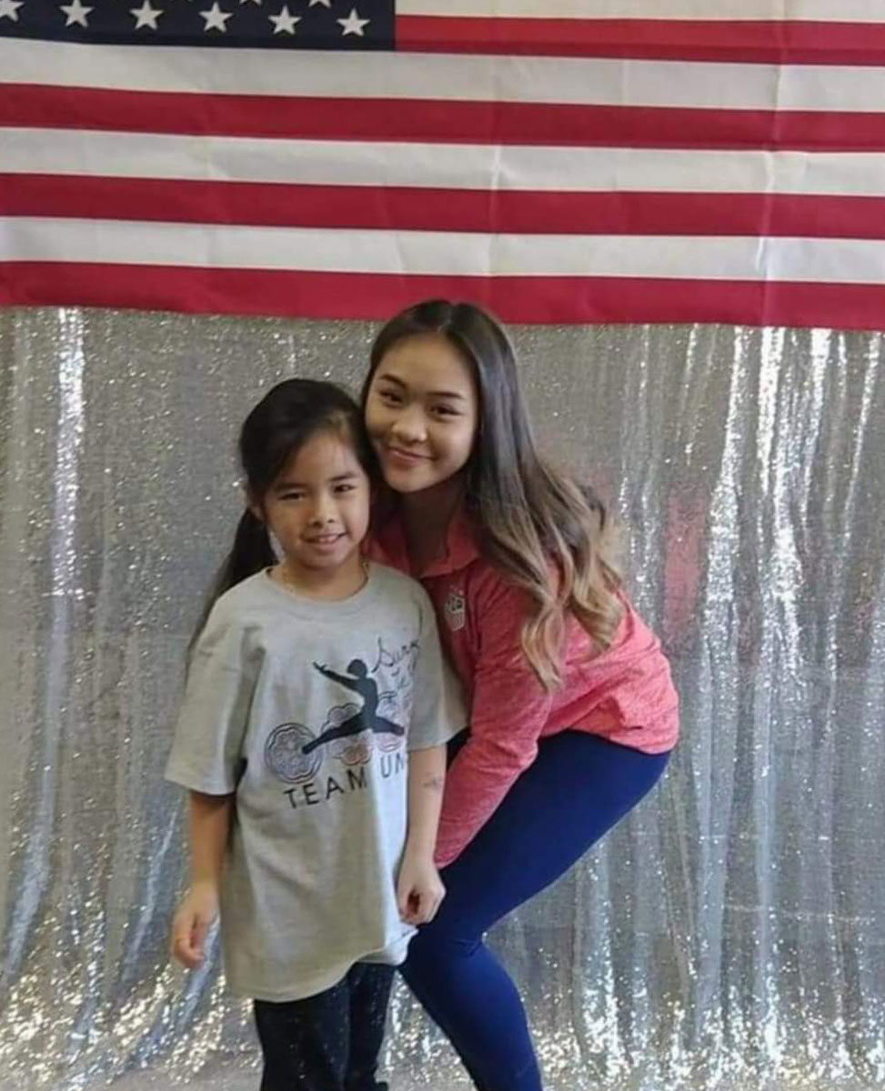 Emma Nguyen, who has practiced gymnastics since she was 3 years old, poses with Sunisa Lee. (Courtesy Photo)