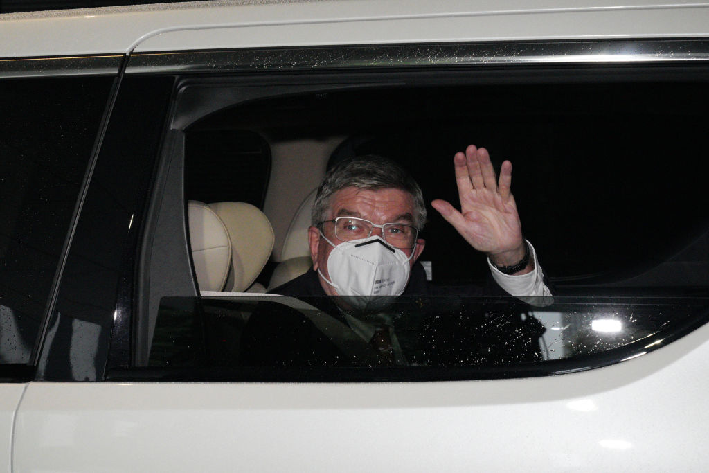 International Olympic Committee president Thomas Bach waves to media as he arrives at an accommodation ahead of the delayed Tokyo Olympic Games in Tokyo, Japan on July 8, 2021. (Eugene Hoshiko—Pool/Getty Images)
