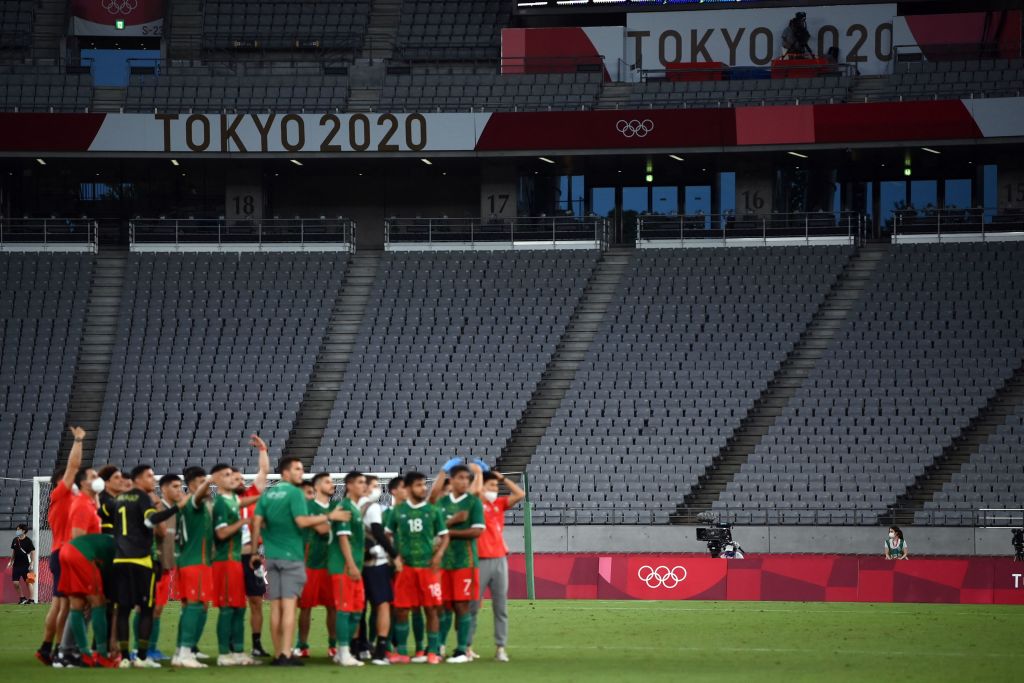 Mexico team celebrate their victory at the end of the Tokyo 2020 Olympic Games men's group A first round football match between Mexico and France at Tokyo Stadium in Tokyo on July 22, 2021. (Franck Fife—AFP/Getty Images)