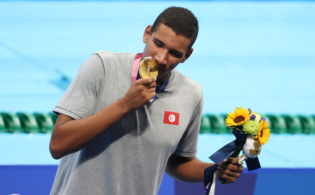 Gold medalist Ahmed Hafnaoui of Tunisia during the medals ceremony of the 400-m freestyle final on day two of the Tokyo 2020 Olympic Games at Tokyo Aquatics Centre on July 25, 2021 in Tokyo, Japan. (Jean Catuffe—Getty Images)