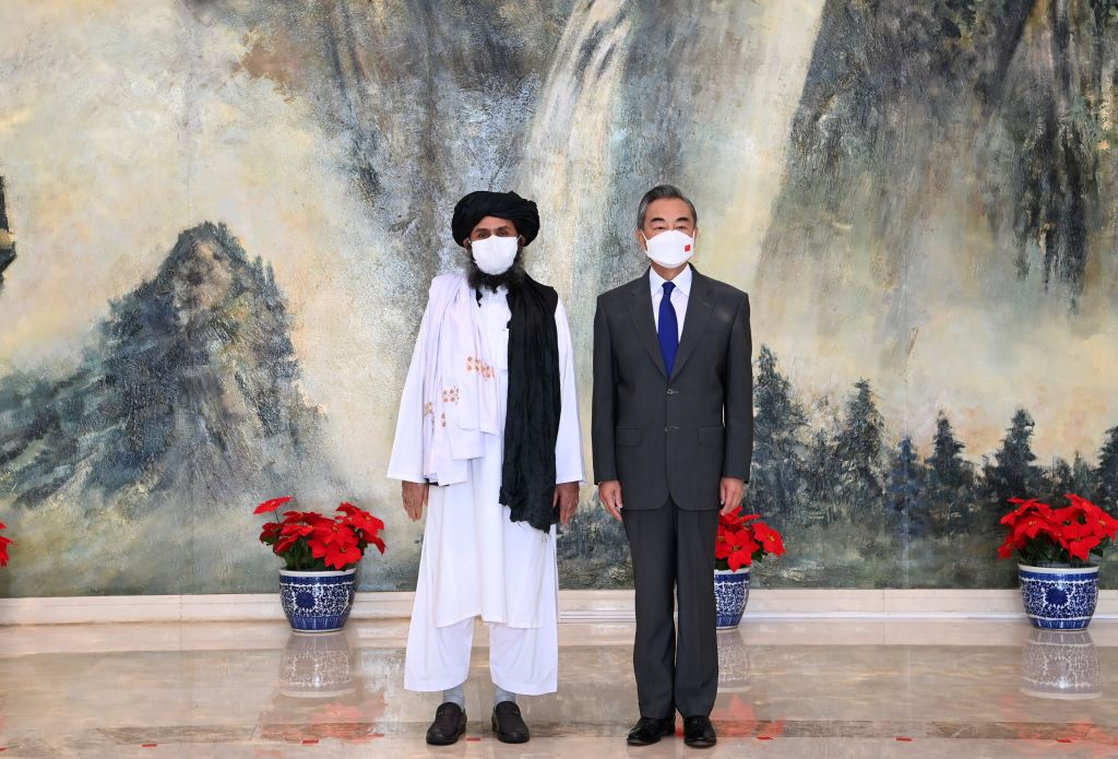 Chinese State Councilor and Foreign Minister Wang Yi meets with Mullah Abdul Ghani Baradar, political chief of Afghanistan's Taliban, in north China's Tianjin, July 28, 2021. (Li Ran/Xinhua via Getty Images)
