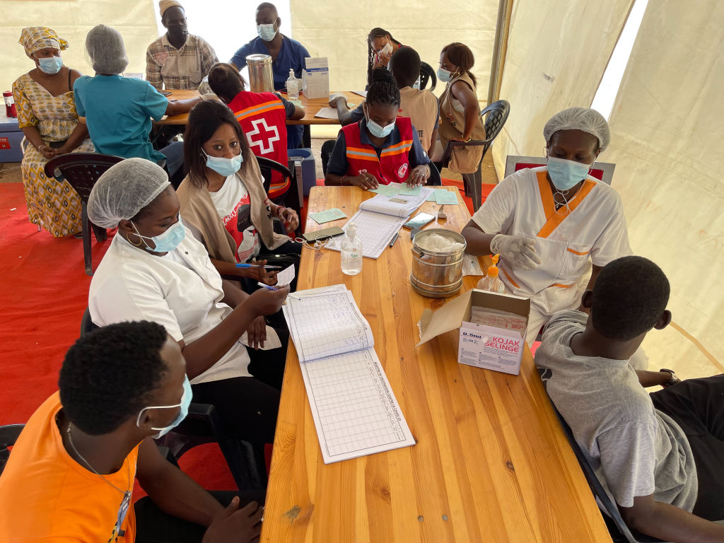 People wait to receive a vaccine against coronavirus (COVID-19) in Dakar, Senegal on Aug. 1, 2021 (Fatma Esma Arslan—Anadolu Agency via Getty Images)