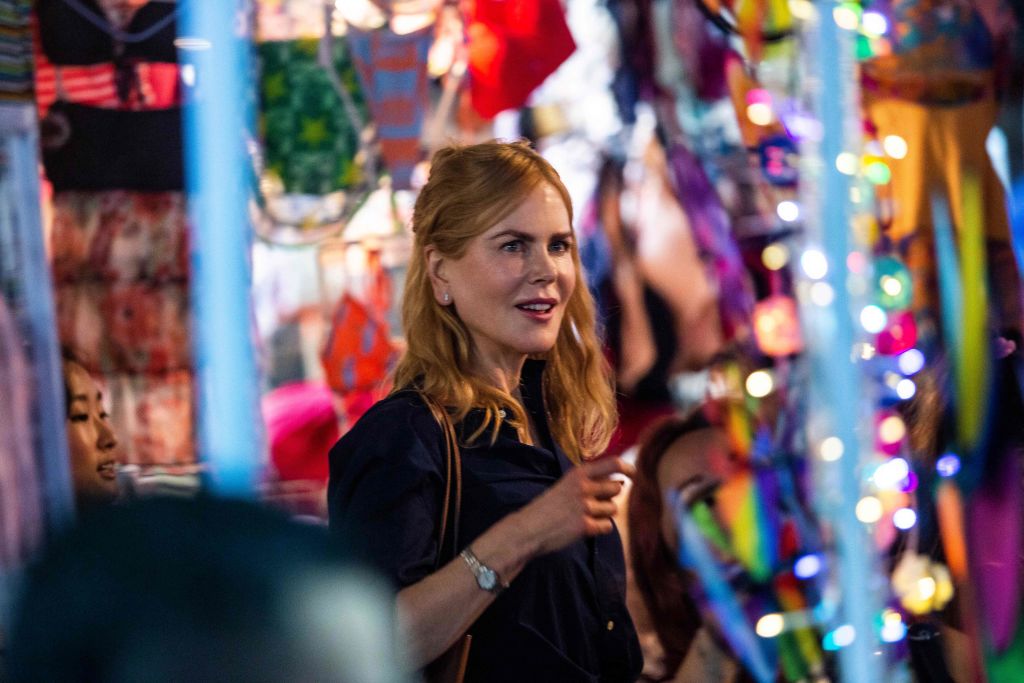 Actress Nicole Kidman films a scene in a market in Hong Kong on August 23, 2021, from the Amazon Prime Video series titled Expats, a show based on a 2016 book by Janice YK Lee about the gilded lives of three American women in the city. (ISAAC LAWRENCE/AFP via Getty Images\)