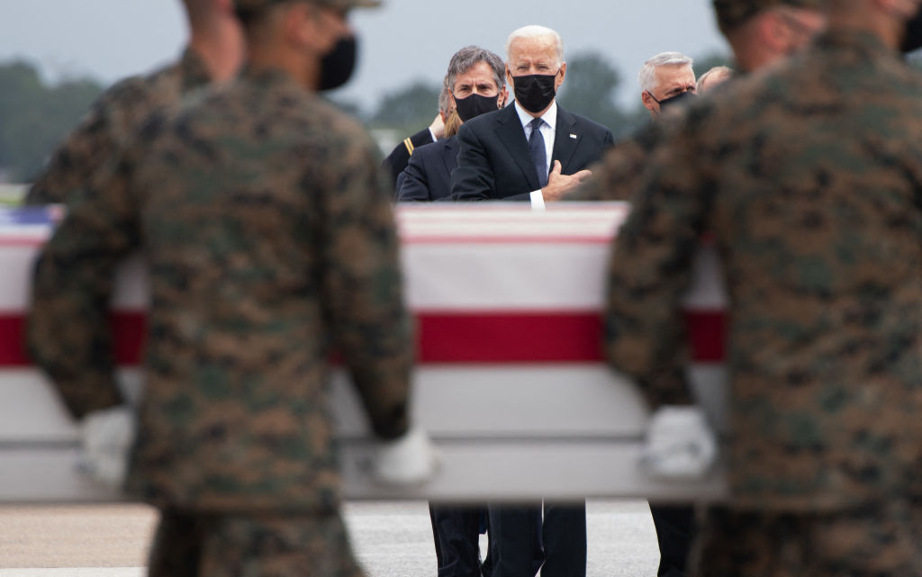 President Joe Biden attends the dignified transfer of the remains of fallen service members at Dover Air Force Base in Dover, Delaware, August, 29, 2021, after 13 members of the US military were killed in Afghanistan. (Saul Loeb/AFP—Getty Images)
