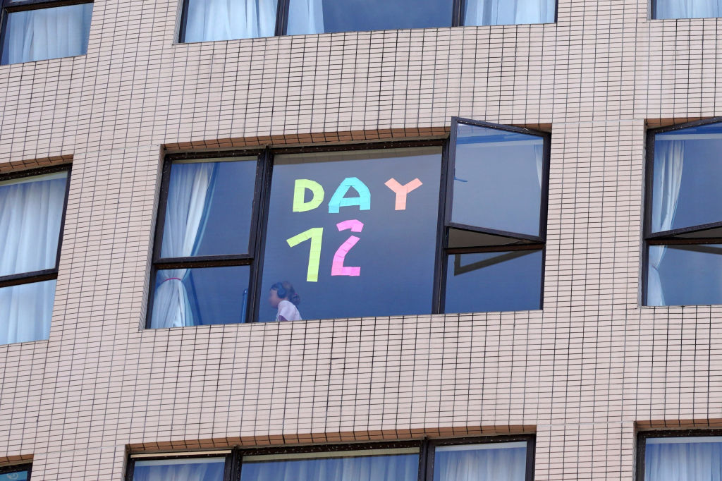 'Day 12' stickers are displayed on the window of Dorsett Wanchai Hong Kong Hotel to record quarantine days on August 17, 2021 in Hong Kong, China. (Zhang Wei/China News Service via Getty Images)