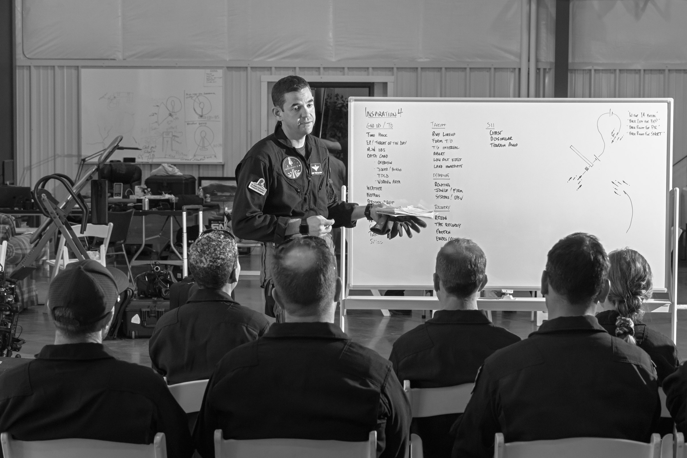Jared Isaacman briefs the Inspiration4 crew before a training session in Belgrade, Mont., on Aug. 7, 2021. (Philip Montgomery for TIME)
