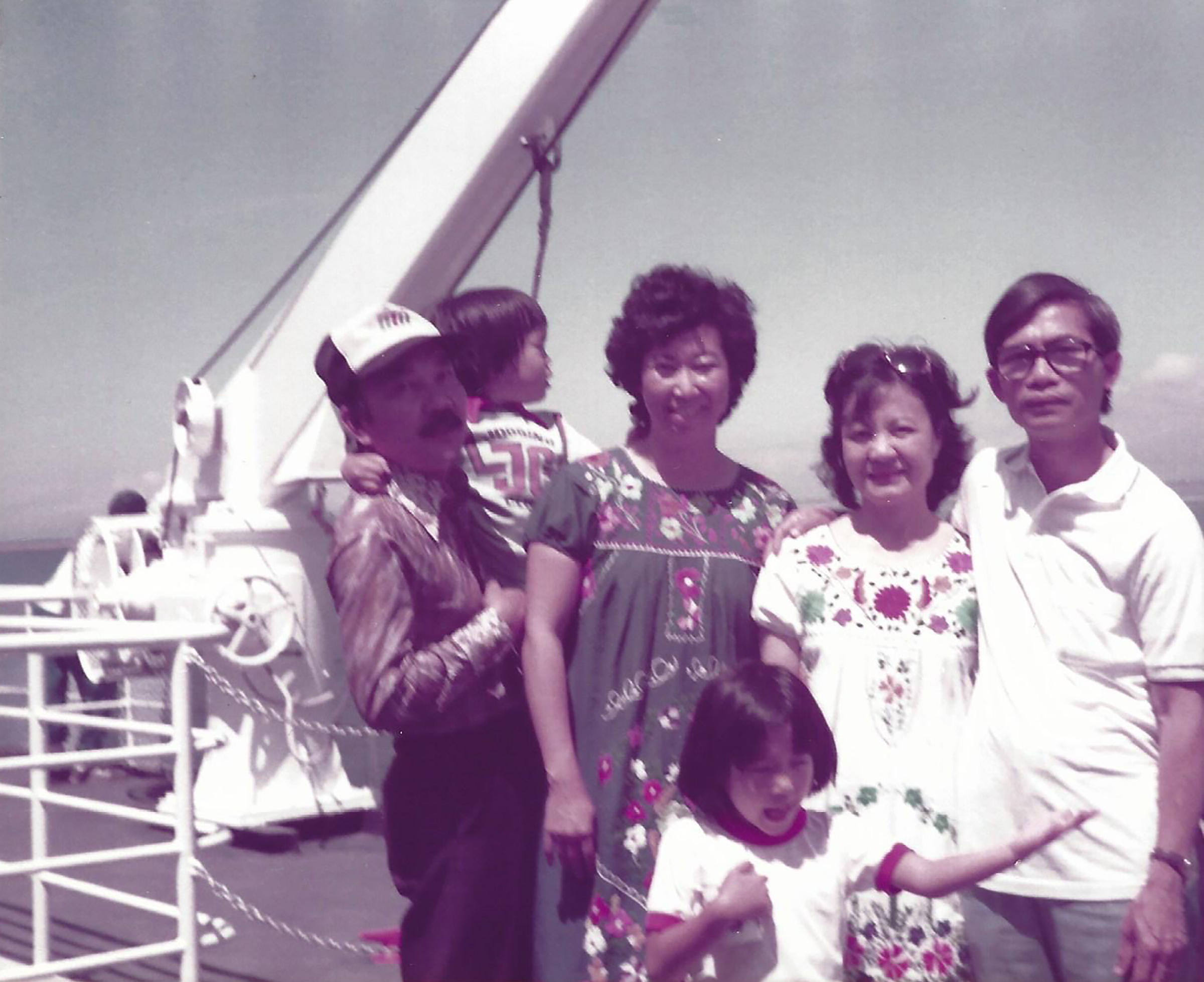 Aimee Phan, center, with, from left, her father, brother, mother, aunt and uncle in Vancouver, Canada, summer 1983.