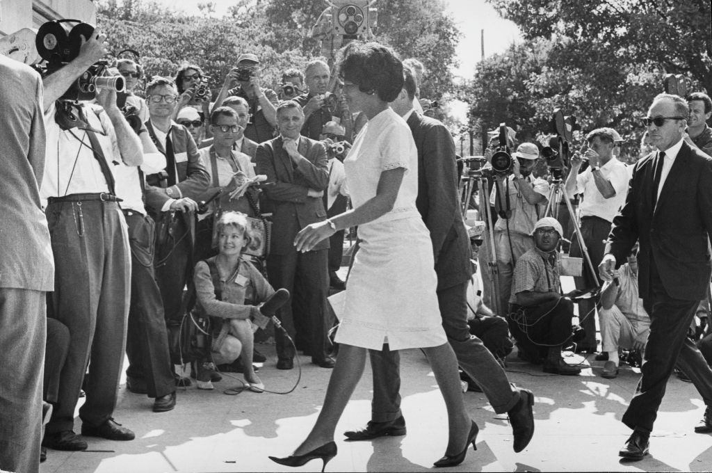 American students Vivian Malone (1942-2005) and James Hood (1942-2013) walk through the crowds as they become the first African American students to enrol at the University of Alabama in Tuscaloosa, Alabama, 11th June 1963. (Daily Express/Archive Photos/Hulton Archive)