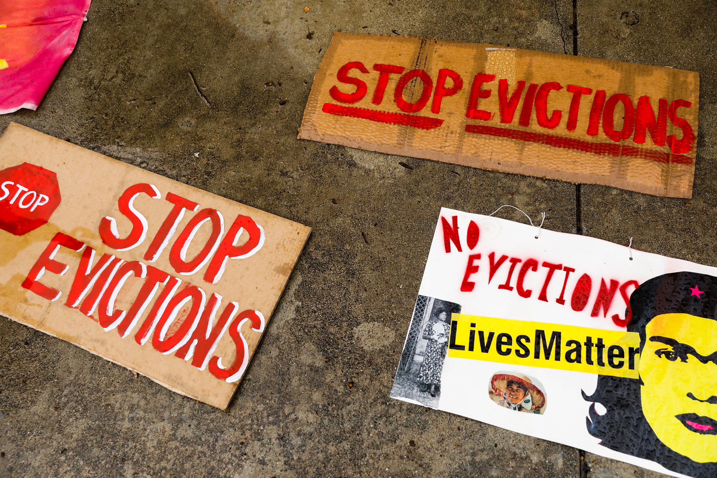 Signage lays on the ground during a protest outside the Santa Clara County Courthouse in San Jose to halt eviction proceedings from taking place on Jan. 27. Although rent moratoriums were instituted to help people who lost their jobs due to coronavirus shutdowns, certain types of eviction actions are still going forward. (Gabrielle Lurie—The San Francisco Chronicle/Getty Images)