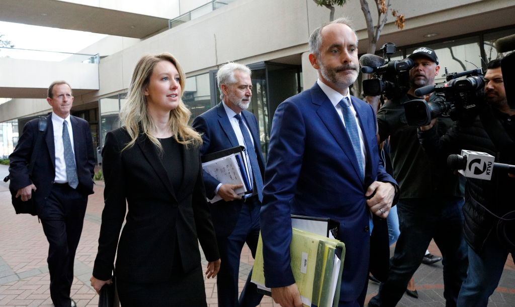 Former Theranos CEO Elizabeth Holmes and lawyer Kevin Downey leave a federal court after a status hearing on July 17, 2019 in San Jose, California. (Kimberly White—Getty Images)